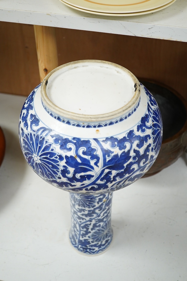 A Chinese blue and white bottle vase with lotus decoration, restored, Kangxi Period, 44cm high